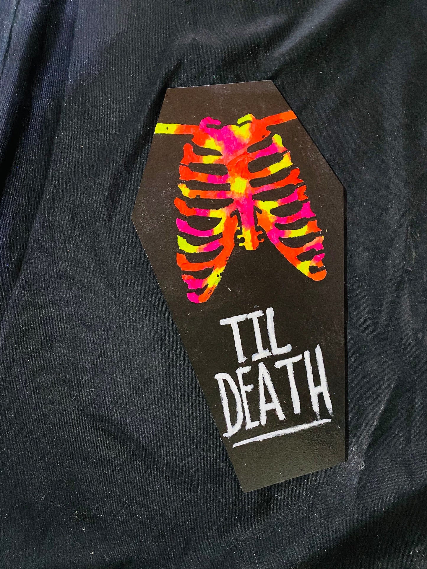Coffin shaped “til death” art