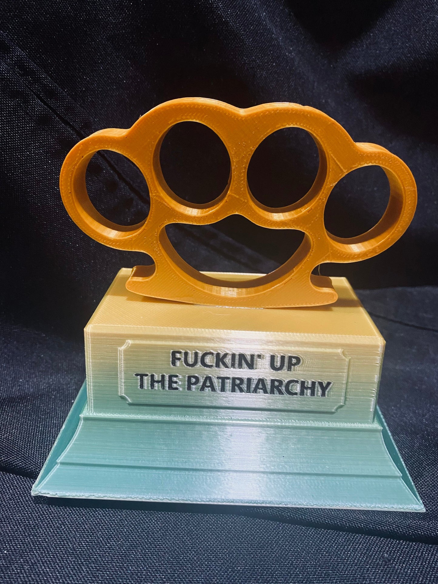 F-cking up the patriarchy trophy with knuckle