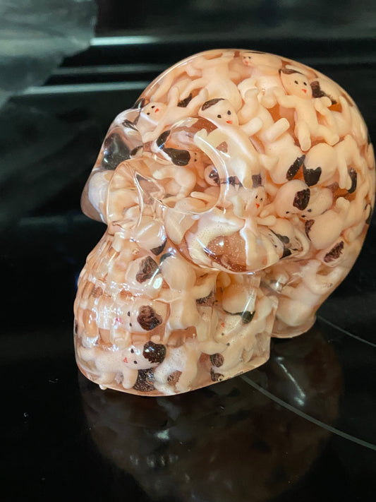 Skull made out of tiny plastic babies