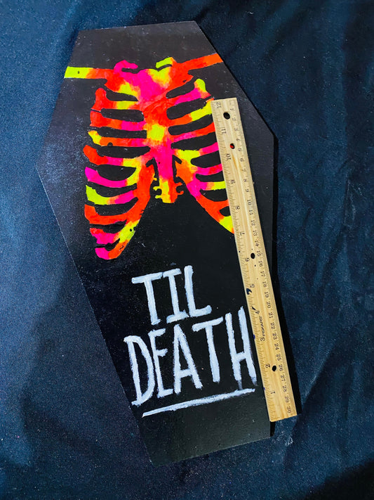 Coffin shaped “til death” art