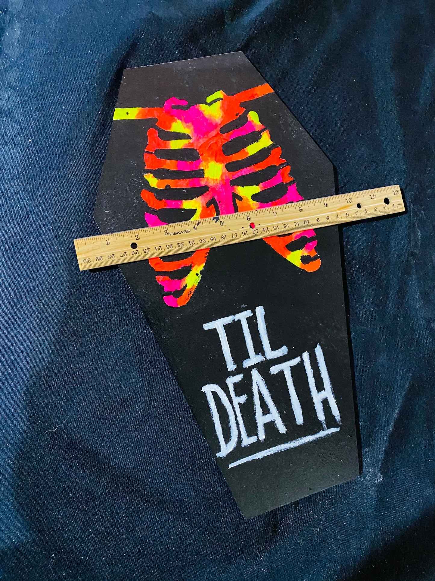Coffin shaped “til death” art